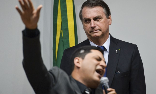 O presidente Jair Bolsonaro em culto evangélico na Câmara