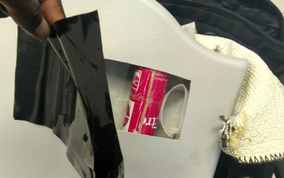 Homem escondia celular em fundo falso de tampa de vaso sanitÃ¡rio (Foto: DivulgaÃ§Ã£o/Guarda Civil)