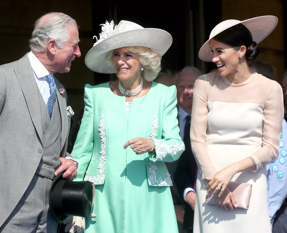 Rei Charles III, Rainha Consorte Camilla e Meghan Markle