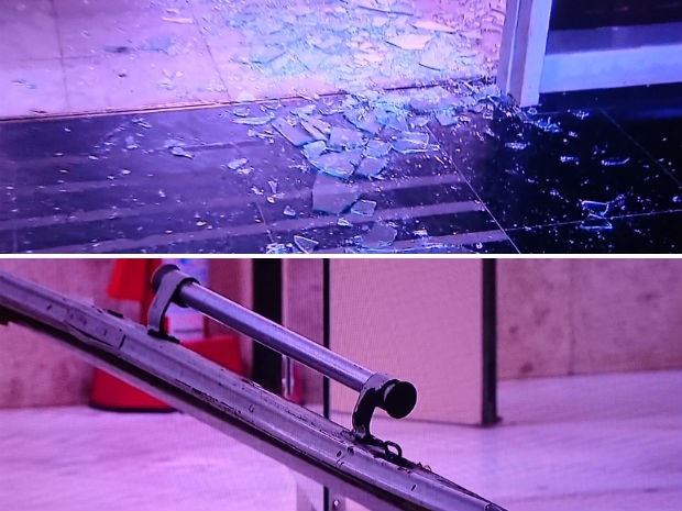 Detalhes do vidro estilhaçado e da porta quebrada em sede do Ministério da Fazenda, em Brasília, após invasão de carro (Foto: TV Globo/Reprodução)