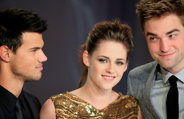 Taylor Lautner, Kristen Stewart e Robert Pattinson, em Berlim, Alemanha (Foto: AFP)