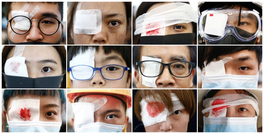Manifestantes em Hong Kong usam gaze sobre um dos olhos, em referência aos colegas feridos nos olhos pela polícia — Foto: Reuters/Thomas Peter 