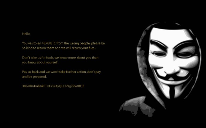 Papel de parede com a imagem de Guy Fawkes com mensagem para a vítima (Foto: Divulgação/Avast)