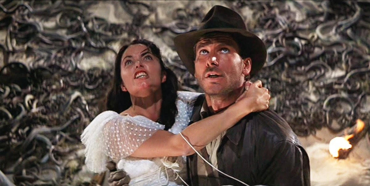 Os atores Karen Allen e Harrison Ford em Indiana Jones e os Caçadores da Arca Perdida (1981) (Foto: Reprodução)