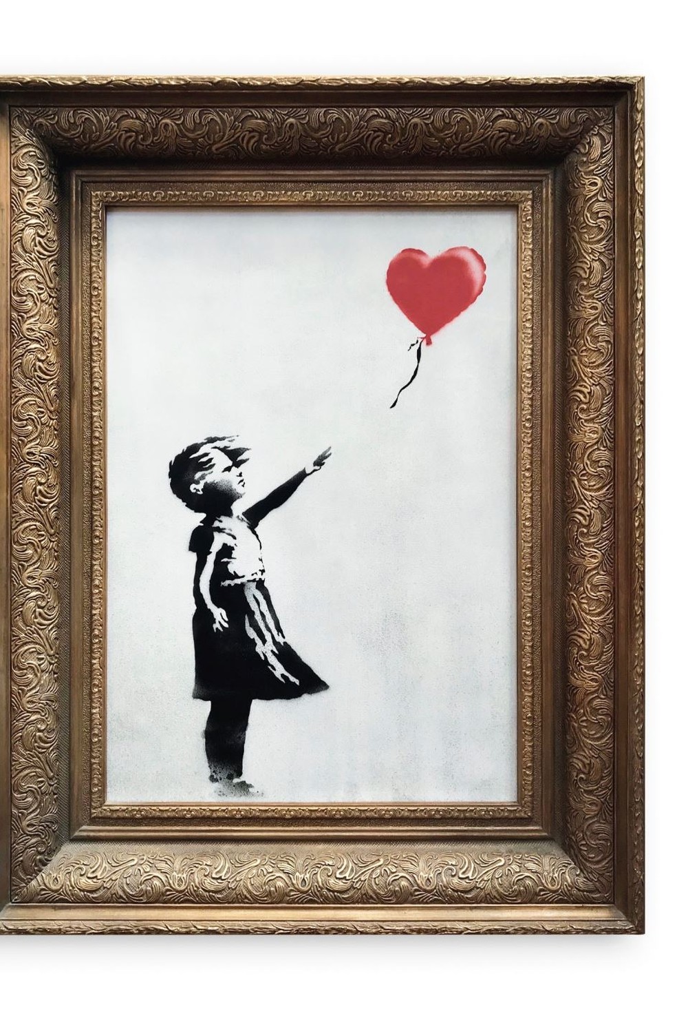 A obra 'Girl With Balloon', de Banksy, antes de ser leiloada e triturada â Foto: DivulgaÃ§Ã£o/Sotheby's