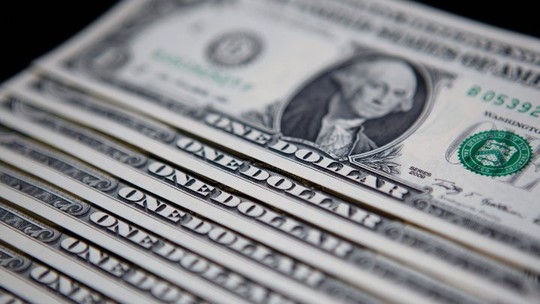 Dólar opera perto da estabilidade ante o real após Copom e Fed
