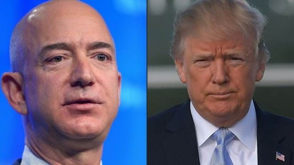  Bezos, fundador da Amazon, e Trump: presidente dos EUA foi acusado pela empresa de fazer 'pressão imprópria' em contrato do Departamento de Defesa — Foto: France Presse