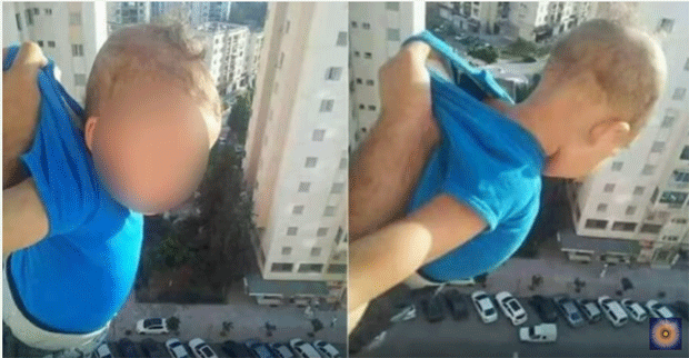 Menino é sacudido em janela do 15º andar (Foto: Reprodução / YouTube)