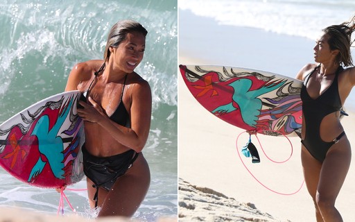 Danni Suzuki surfa com amigos na praia da Macumba, no Rio de Janeiro