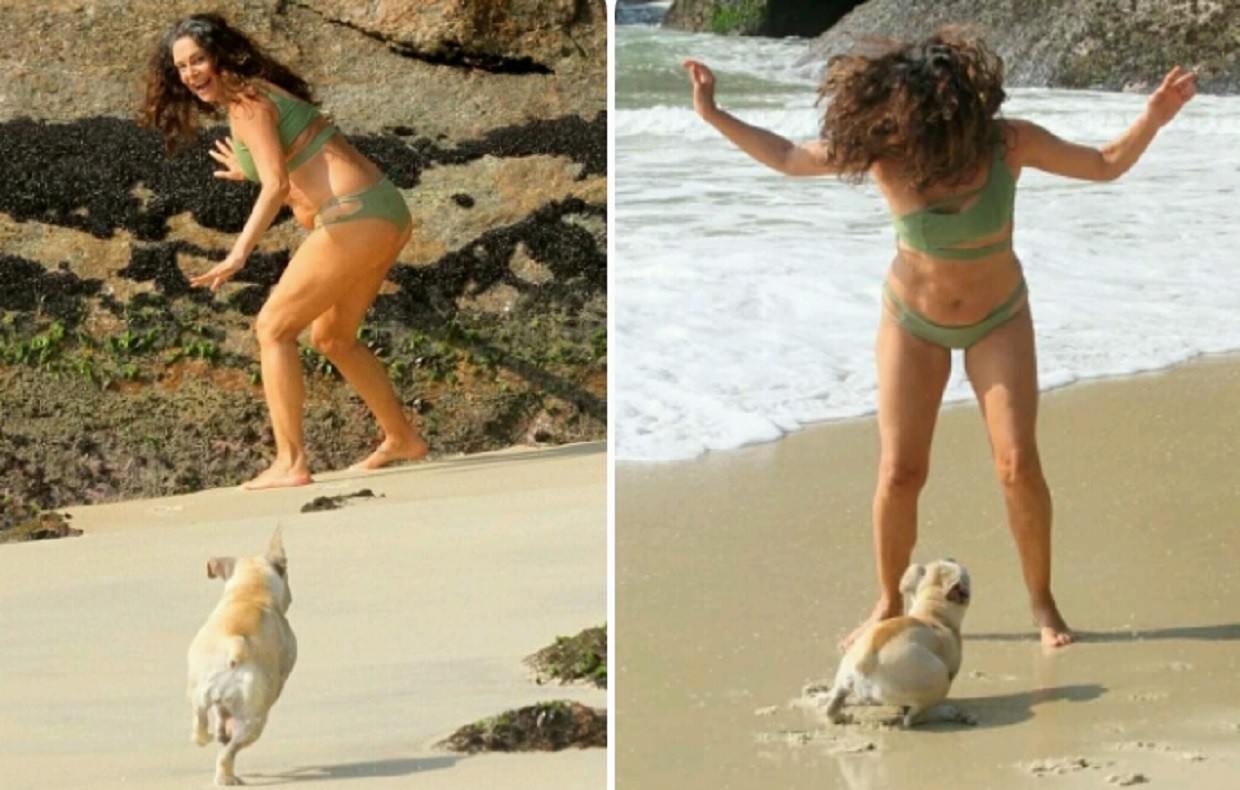 Giovanna Gold se surpreende com cachorro em praia carioca (Foto: Daniel Delmiro/AgNews)