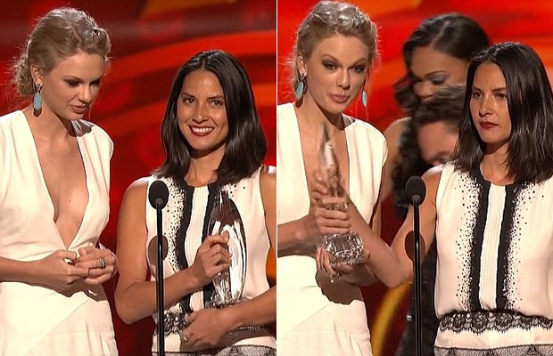 Taylor precisou tirar o prêmio das mãos de Olivia (Foto: Reprodução)