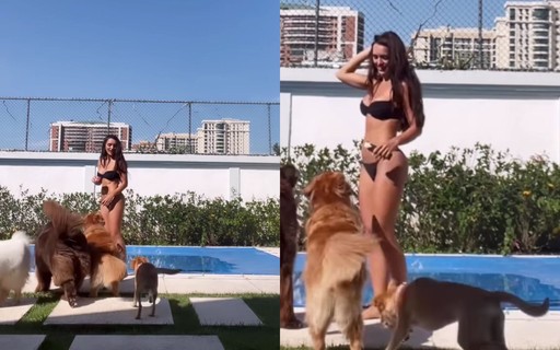 De biquíni, Rafa Kalimann brinca com cachorros à beira da piscina