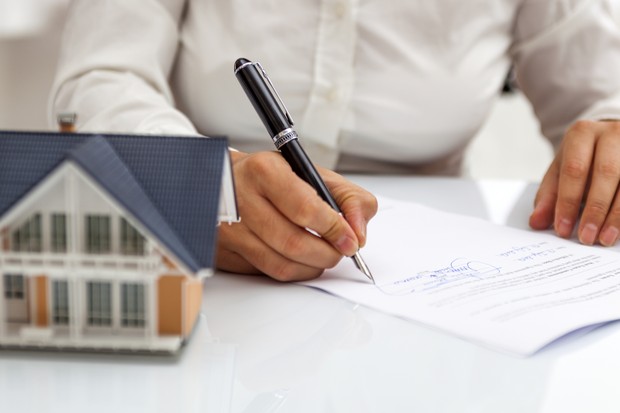 Purchase agreement for hours with model home (Foto: Getty Images)