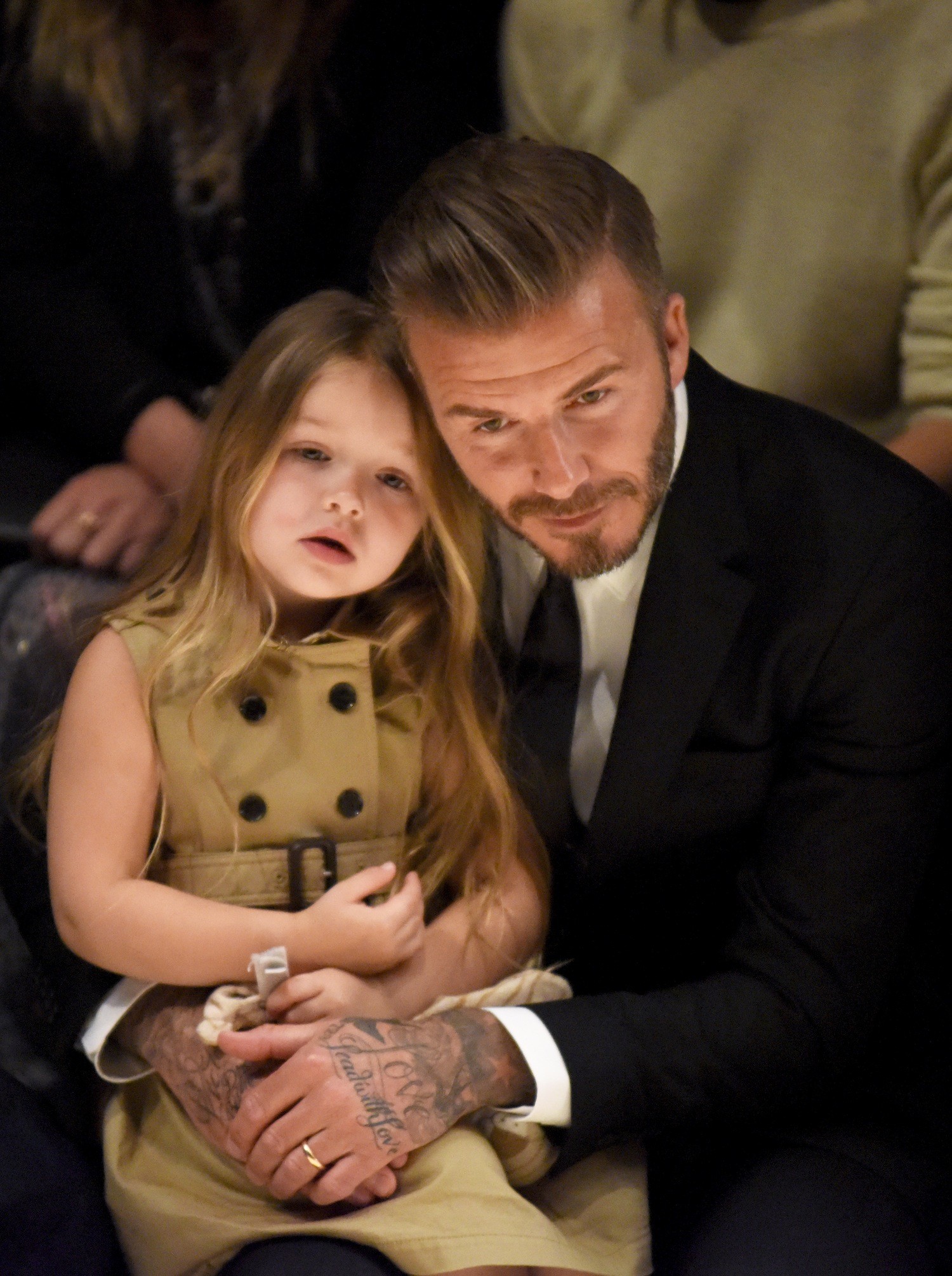 LOS ANGELES, CA - APRIL 16:  Harper Beckham (L) and David Beckham attend the Burberry 