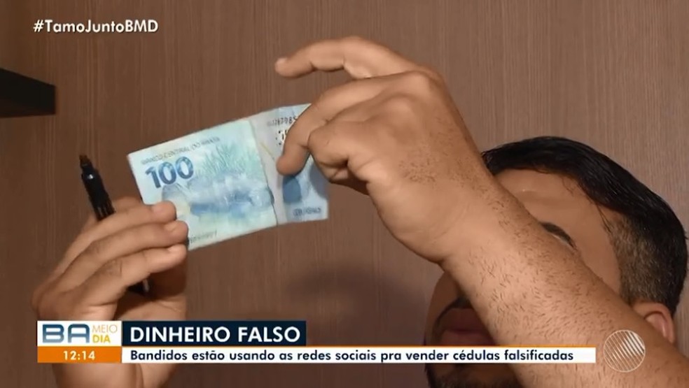 PolÃ­cia Federal orienta que as caracterÃ­sticas das cÃ©dulas sejam observadas no contraluz  â€” Foto: TV Bahia