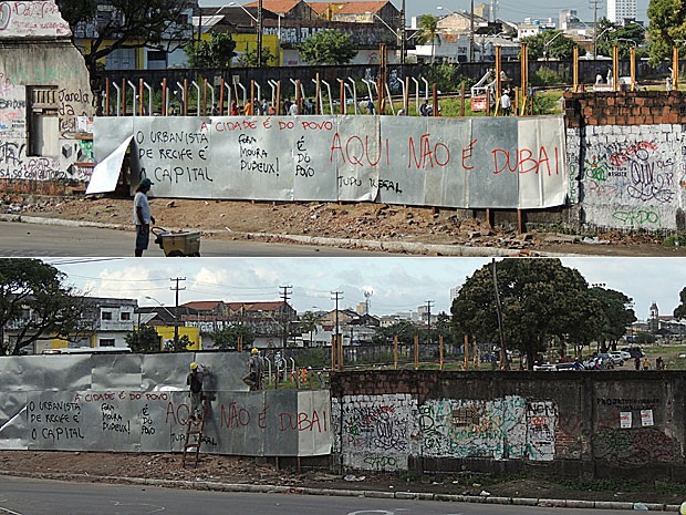 Operários do Consórcio Novo Recife colocam tapumes em muro do terreno no Cais José Estelita (Foto: Débora Soares / G1)