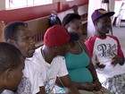 Haitianos se apegam às lembranças para amenizar a saudade em MS