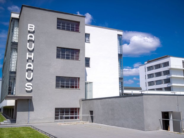 10 July 2019, Saxony-Anhalt, Dessau-Roßlau: The Bauhaus ensemble in Dessau-Roßlau can be seen under bright sunshine and blue skies.  In 2019, together with partners from all over the world, Germany is celebrating the 100th anniversary of the Bauhaus.  Photo: Jens Buttn (Photo: photo alliance via Getty Image)
