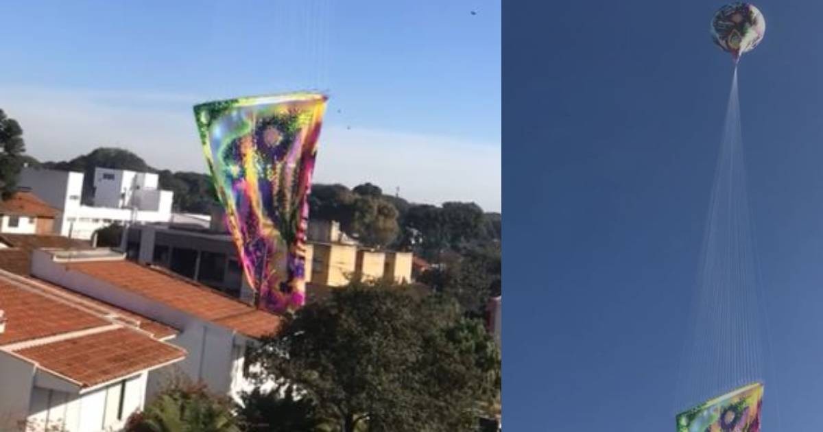 Estrutura de balão cai em rua de Curitiba, pega fogo e assusta moradores; VÍDEO