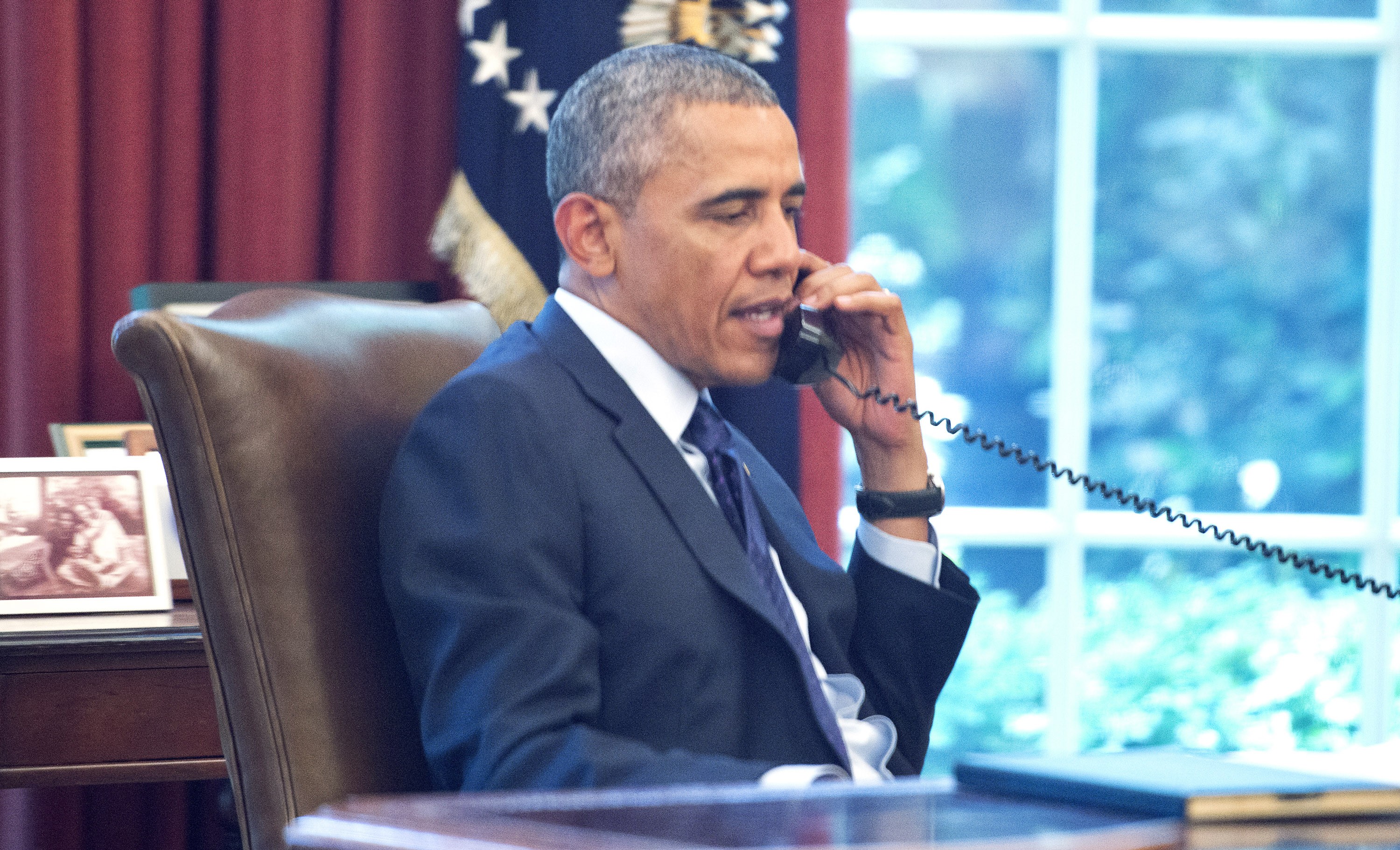 Obama, em uma conferência telefônica com grupos de saúde pública, apresenta seu novo plano (Foto: getty)