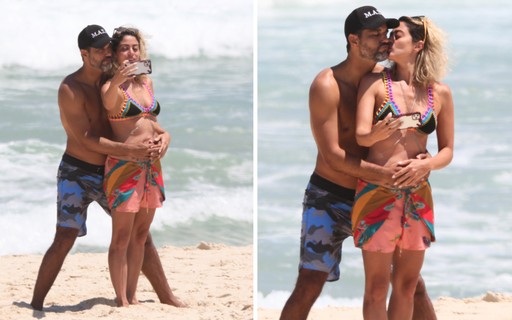 Carol Castro e Bruno Cabrerizo trocam carinhos em dia de praia no Rio