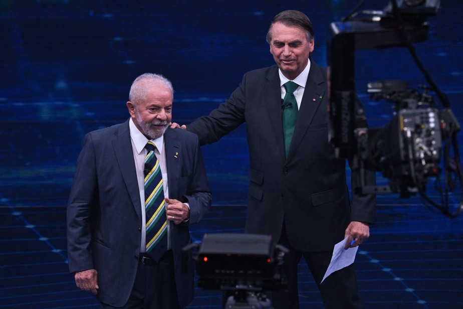 O ex-presidente Luiz Inácio da Silva  e o presidente Jair Bolsonaro no debate da Band