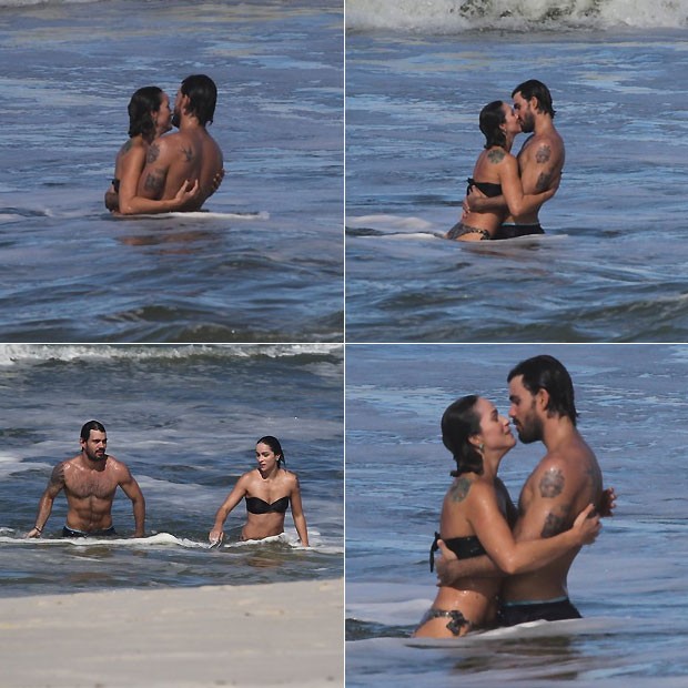 Juliano e Letícia aos beijos no mar (Foto: Ag News)