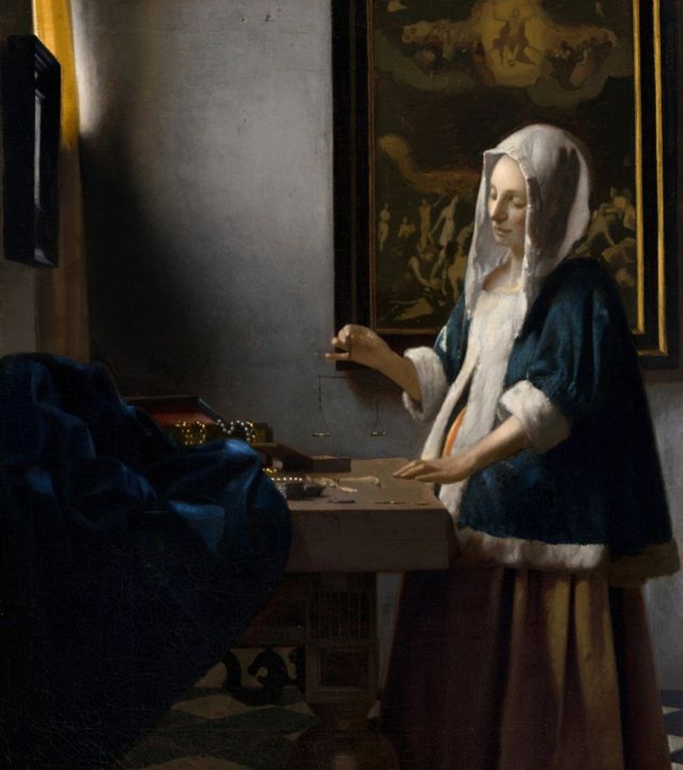 Era comum que nas pinturas aparecessem outros quadros, inclusive em várias obras de Vermeer, como nesta, 'Mulher segurando uma balança', 1662-1665 — Foto: © Washington, National Gallery of Art, Widener Collection