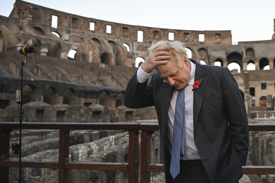 British Prime Minister Boris Johnson visits the Colosseum during the G20 summit in Rome, Saturday, Oct. 30, 2021. A Group of 20 summit scheduled for this weekend in Rome is the first in-person gatheri
