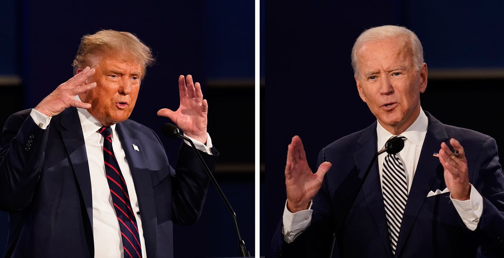 Presidente americano, Donald Trump, e o ex-vice-presidente Joe Biden durante o primeiro debate presidencial nesta terça-feira (29), em Cleveland, Ohio  — Foto: Patrick Semansky/AP