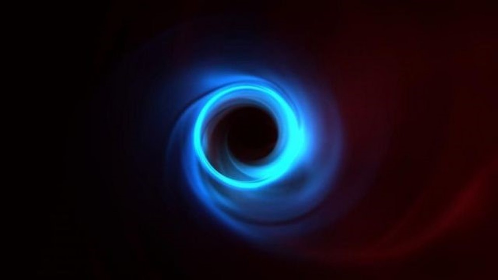 A força gravitacional de um buraco negro é tão forte que nada, nem mesmo a luz, consegue escapar (a imagem é uma simulação) — Foto: LIA MEDEIROS/INSTITUTE FOR ADVANCED STUDY/PA WIRE