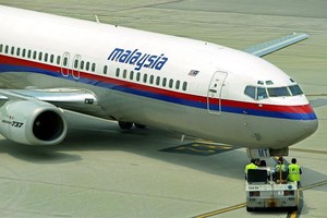 A companhia aérea Malaysia Airlines perdeu o contato com um de seus aviões, um Boeing 777-200, que ia para Pequim com 227 passageiros a bordo (Foto: EFE/EPA/AHMAD YUSNI)