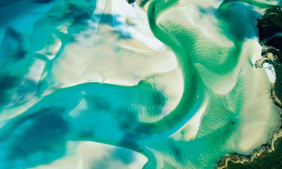 Os bancos de areia no litoral da ilha de Whitsunday, na Austrália, integram o parque marinho da Grande Barreira de Corais, área elogiada pela ONU: houve aumento de preservação no mar