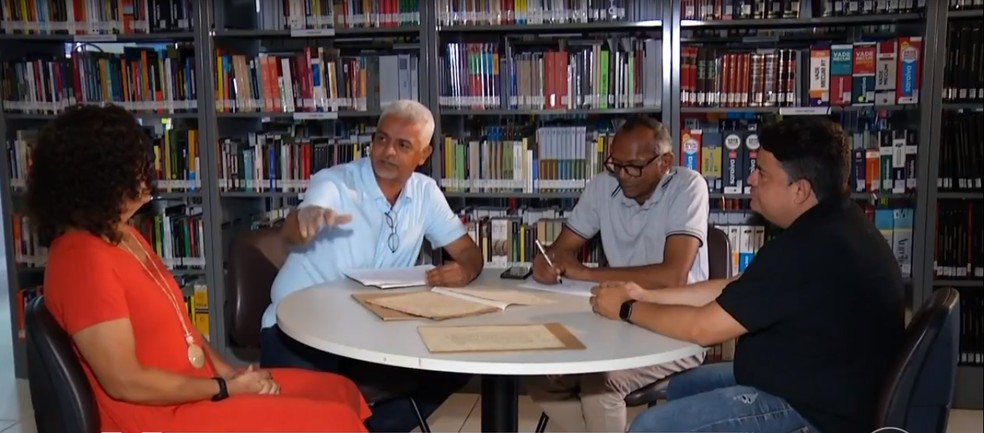 Equipe faz parte do projeto do TJ que resgata processos judiciais antigos — Foto: Reprodução/TV Globo