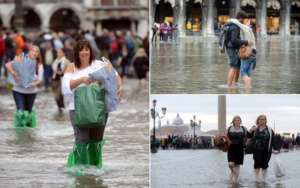 Moradores e turistas molham os pés em meio à primeira 'acqua alta' da temporada em Veneza, na Itália. O fenômeno ocorre com a combinação de marés altas e um forte siroco, vento característico da região do Mar Mediterrâneo. — Foto: Andrea Pattaro/AFP