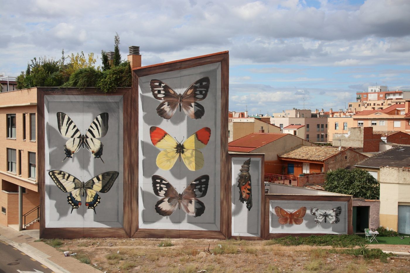 Edifícios ao redor do mundo são transformados em murais hiper-realistas com desenhos de borboletas (Foto: Mantra)