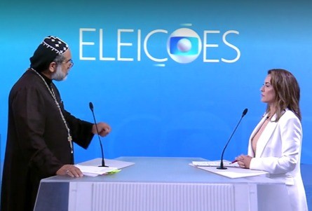 Padre Kelmon e Soraya Thronicke, em debate na TV Globo: falso padre fez parceria com Jair Bolsonaro no programa e Soraya o chamou de "cabo eleitoral"