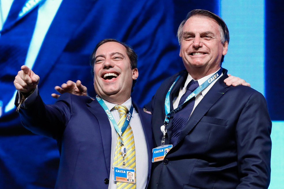 O presidente da Caixa, Pedro Guimarães, e o presidente Jair Bolsonaro em imagem de maio de 2019 — Foto:  Isac Nóbrega/PR