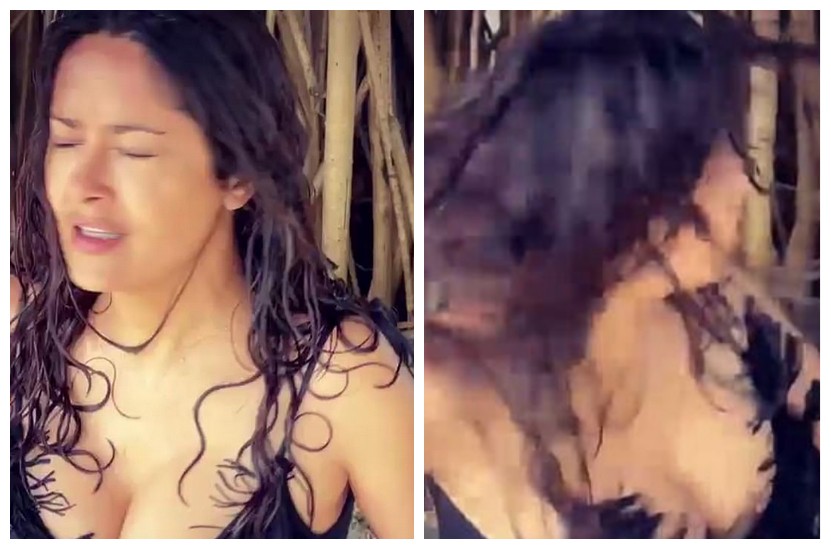 A atriz Salma Hayek balançando a cabeça para secar os cabelos após sair do mar (Foto: Instagram)