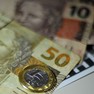 Foto: (Dinheiro, real, moeda de R$ 1, notas de R$ 10 e R$ 50 / Marcello Casal Jr/Agência Brasil)