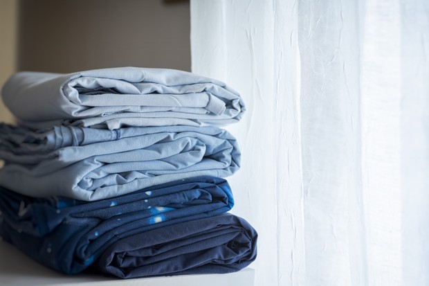 sheets washed and folded ready to be stored in the closet (Foto: Getty Images)