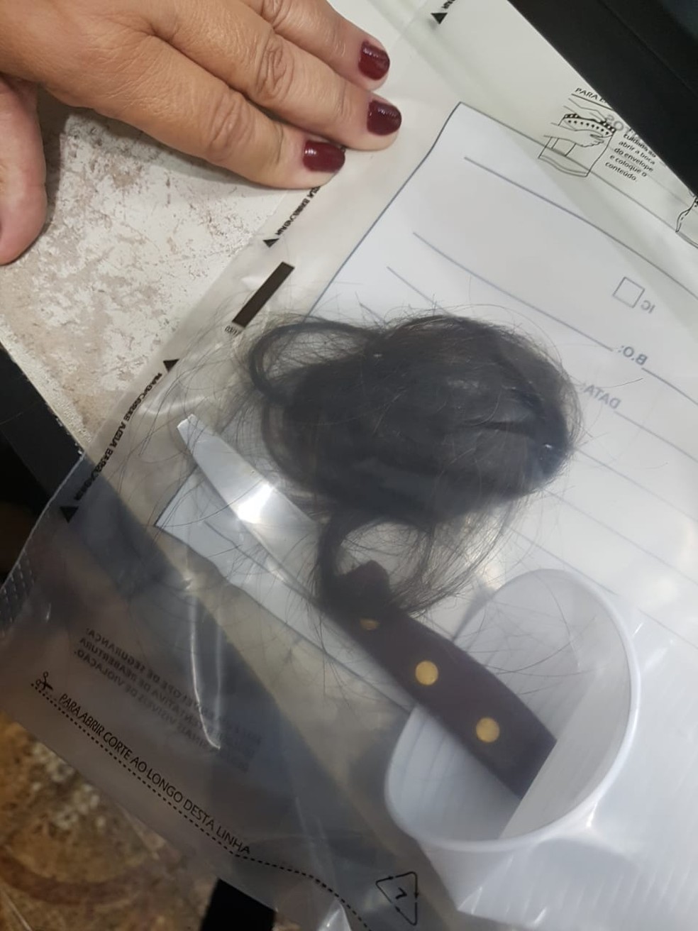 Mãe de aluno arrancou um tufo de cabelo da orientadora educacional, em Cubatão — Foto: G1 Santos