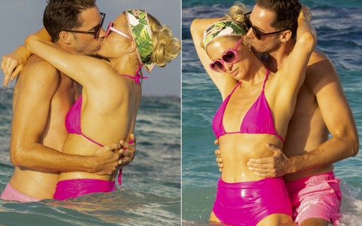 Paris Hilton e o marido trocam beijos e carinhos em praia durante lua de mel no Caribe