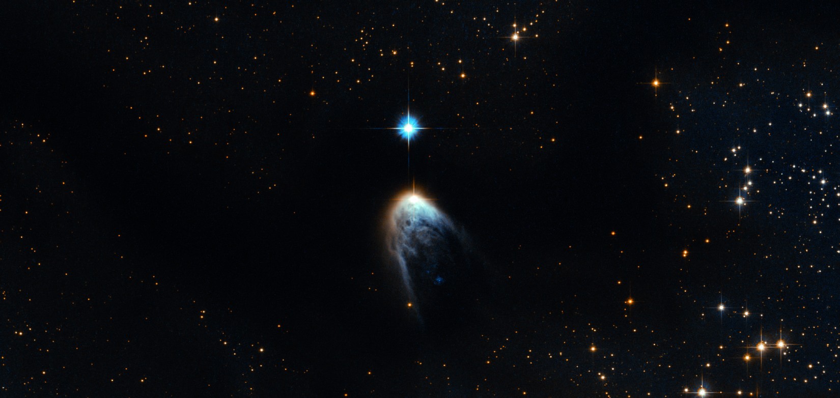 Jovens estrelas em névoa de gás e poeira cósmicas (Foto: ESA/Hubble)