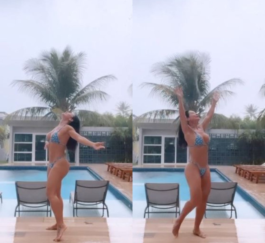 Scheila Carvalho toma banho de chuva de biquíni